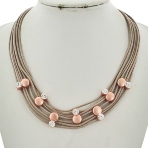 leather and metal disk and rhinestone necklace